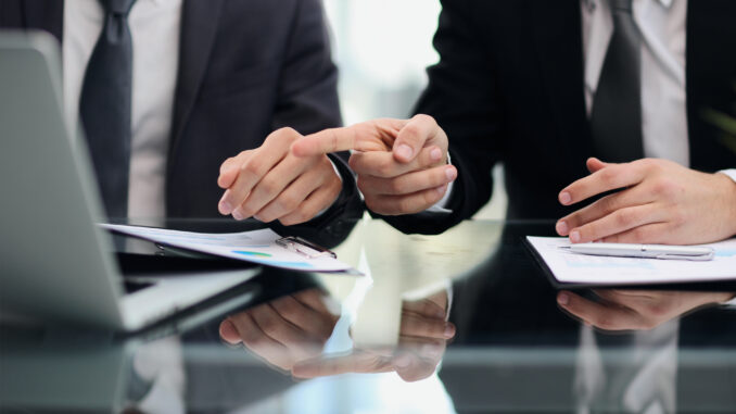 business people making a deal document legal and litigation advisory service concept.
